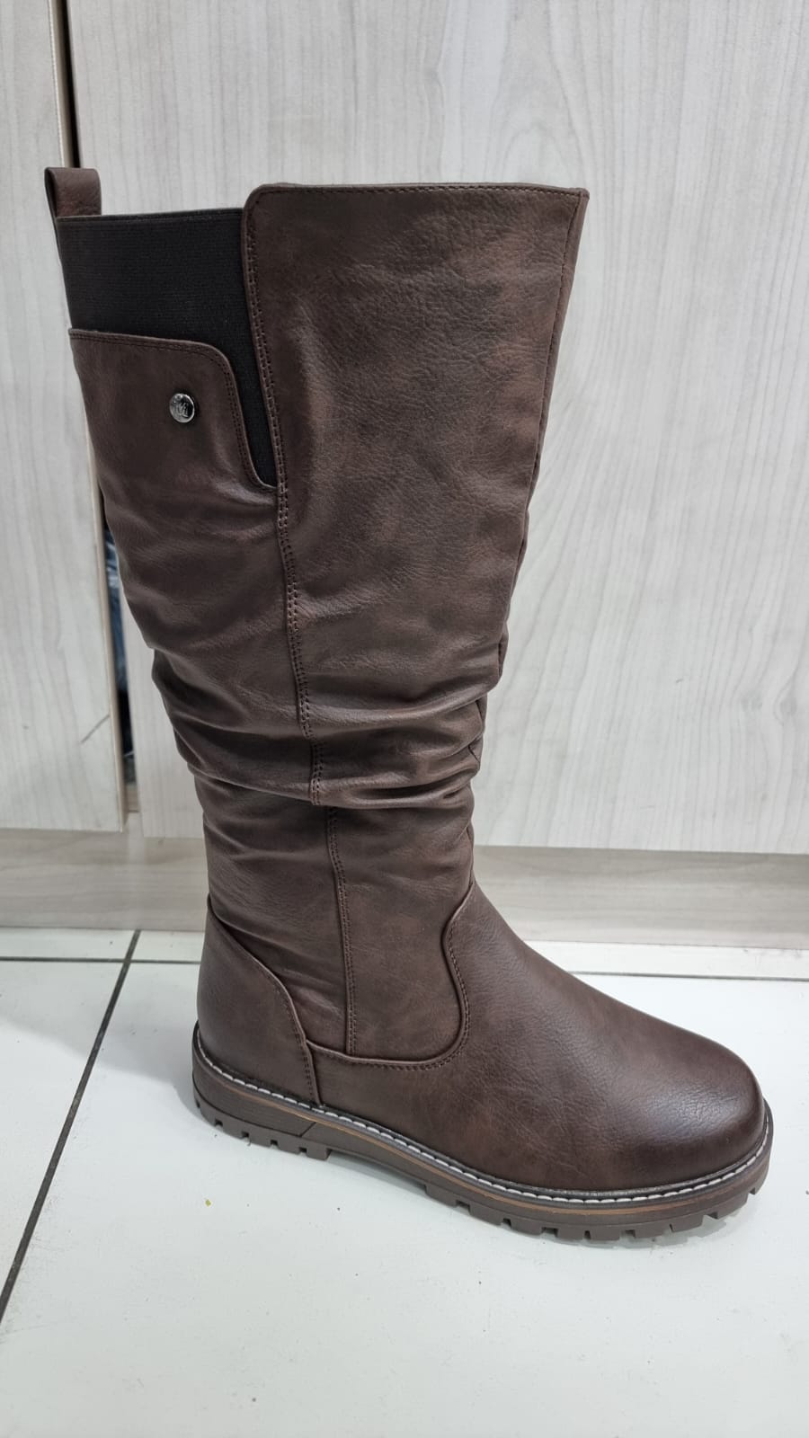 Brown FlexFit knee high comfort boots with stretch side panel and comfortable flat sole for women